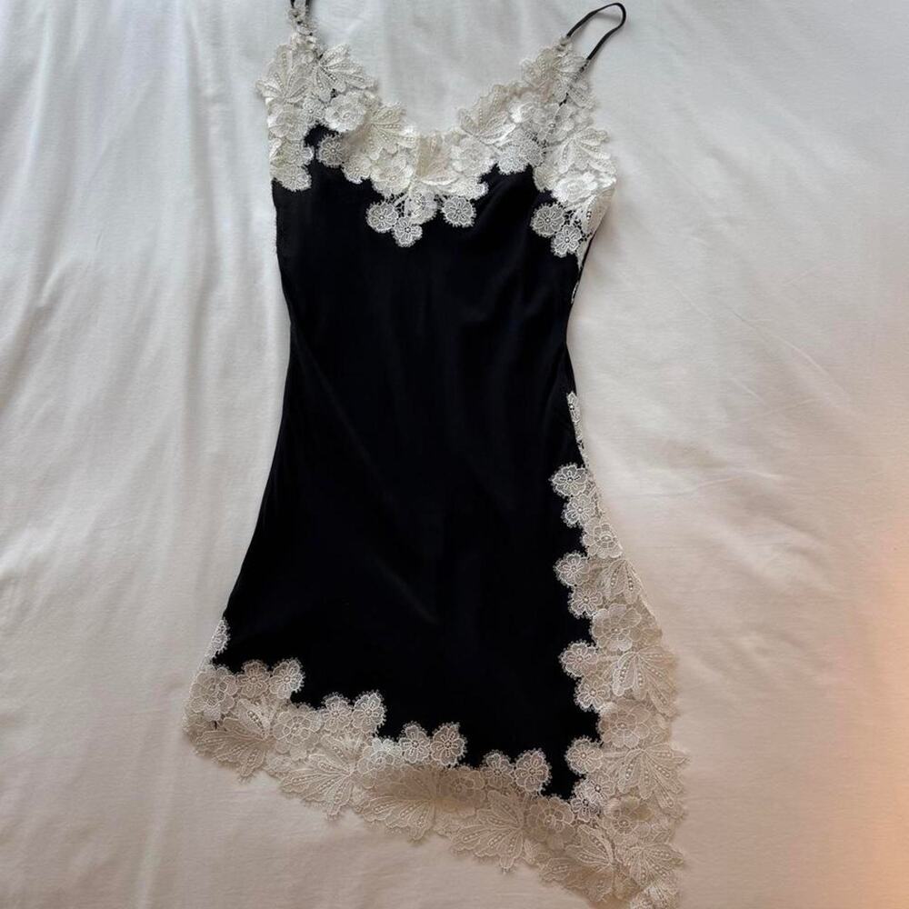 Black slip dress with white lace trim